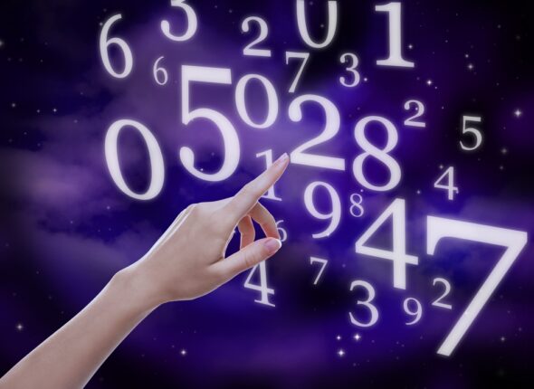 Numerology.,Woman,Pointing,At,Numbers,Against,Sky,,Closeup